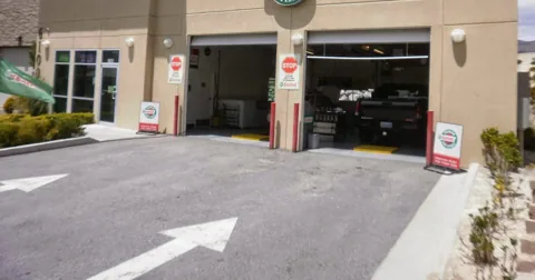 The drive-in bays at the Reno Northwest service center with the entry arrows painted on the pavement
