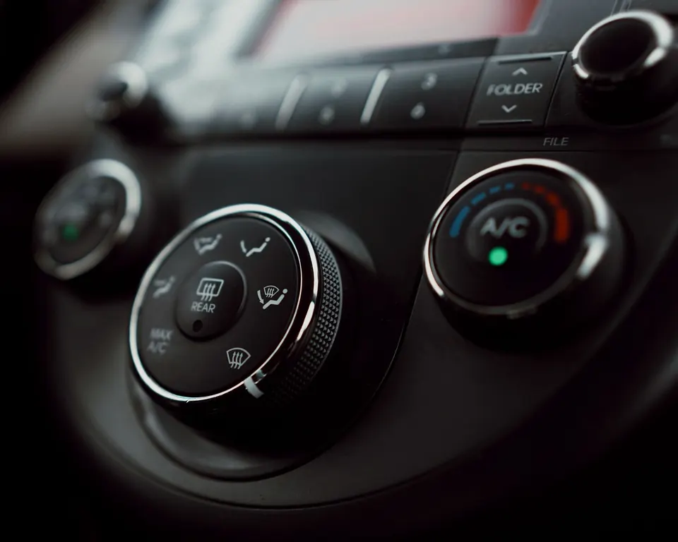 Climate control knobs with the A/C button lit