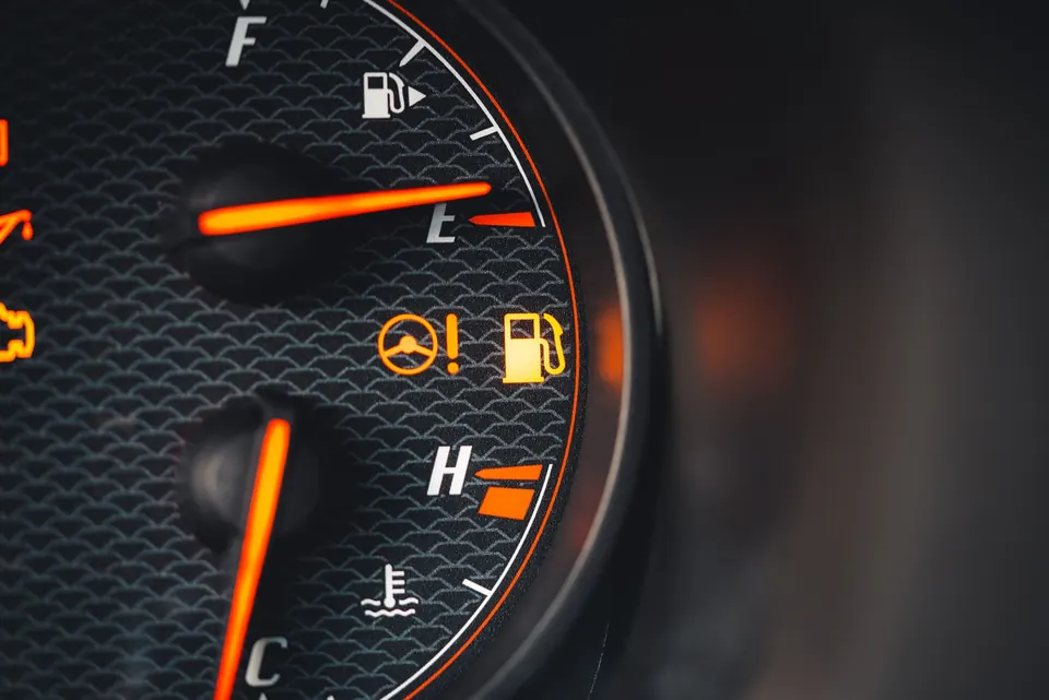 Dashboard gauges with the check engine and other warning lights lit